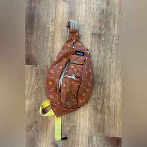 KAVU Rope Sling Bag Rust Sun Print Crossbody Backpack